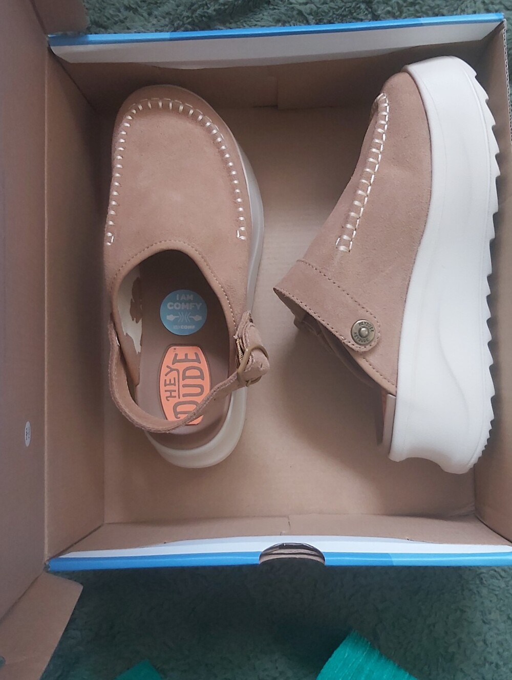 Hey Dude Women’s Suede Slip-On Sandals in Tan.